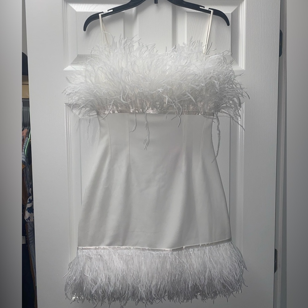 Custom white mini feather dress. Original tags. Never worn